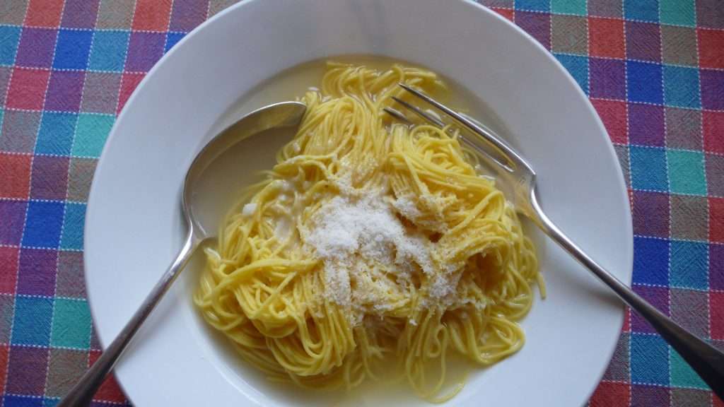 tagliolini-in-brodo tagliolini pasta served with chicken broth and Parmigiano